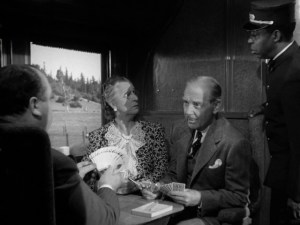 Alfred_Hitchcock_cameo_(1943)_Shadow_of_a_Doubt_2